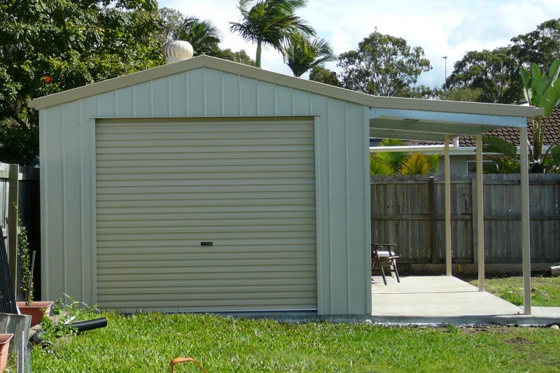 Single residential garage with small awning for added cover